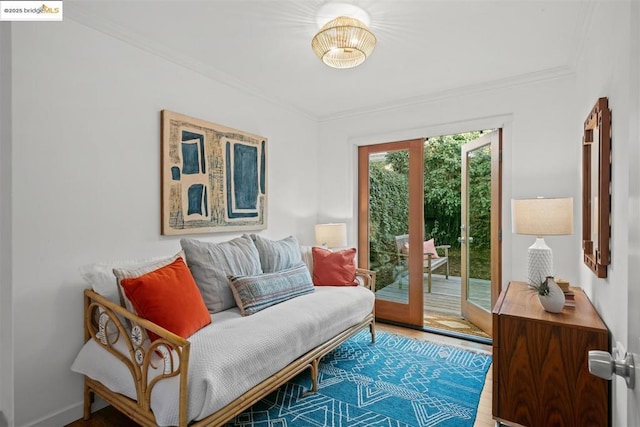 living area featuring french doors and ornamental molding