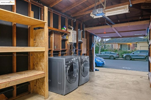 laundry room with a workshop area and separate washer and dryer