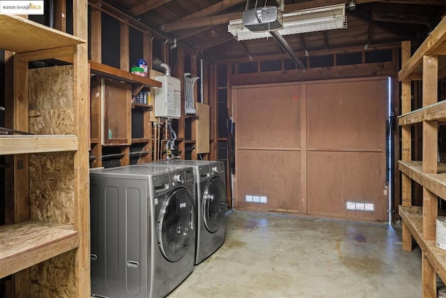 clothes washing area with washing machine and dryer