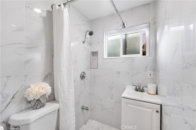 bathroom featuring vanity, curtained shower, and toilet