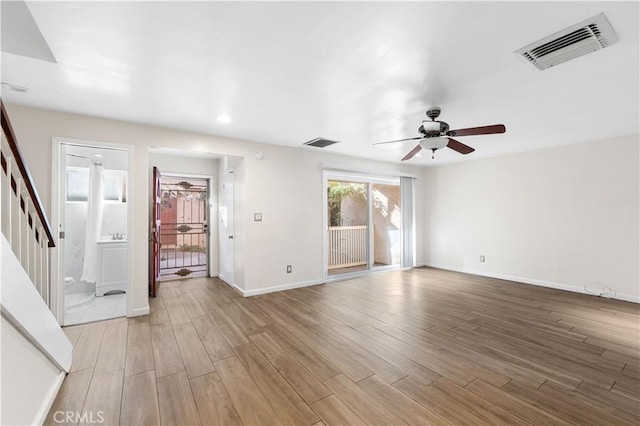 unfurnished room with ceiling fan and hardwood / wood-style flooring