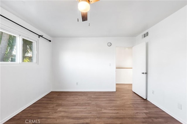 unfurnished room featuring ceiling fan and hardwood / wood-style flooring