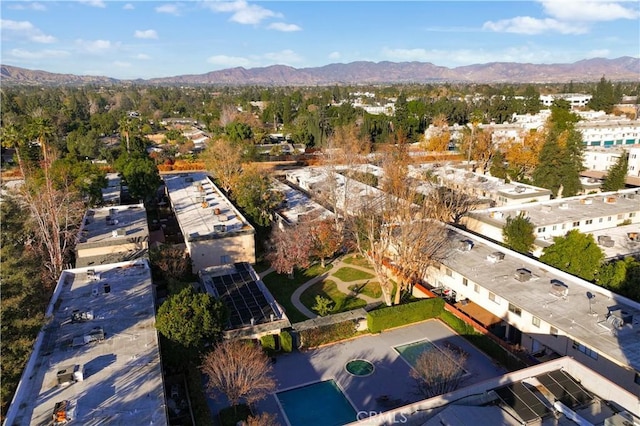 birds eye view of property featuring a mountain view