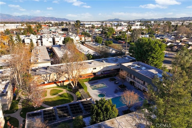 birds eye view of property featuring a mountain view