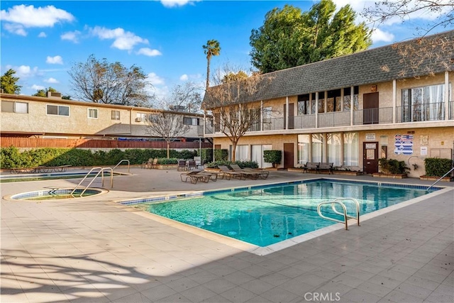 view of swimming pool featuring a patio area