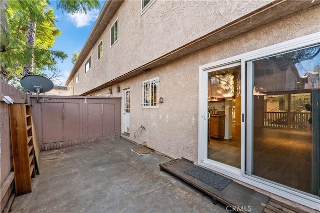 view of side of property featuring a patio