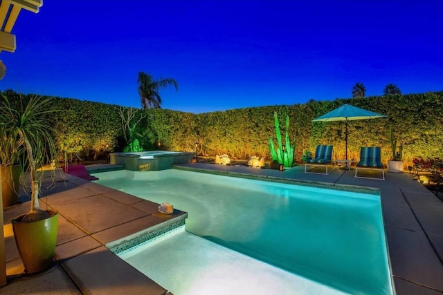 view of pool with an in ground hot tub and a patio