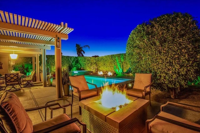 patio terrace at dusk featuring a fenced in pool, a pergola, and an outdoor fire pit