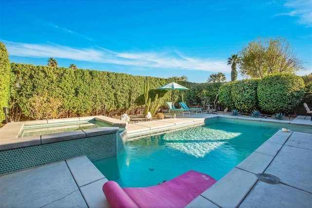 view of swimming pool featuring an in ground hot tub, pool water feature, and a patio area