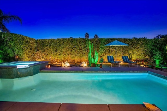 view of swimming pool with an in ground hot tub and a patio area