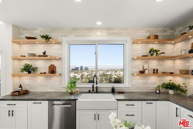 bar featuring sink, white cabinets, tasteful backsplash, and dishwasher