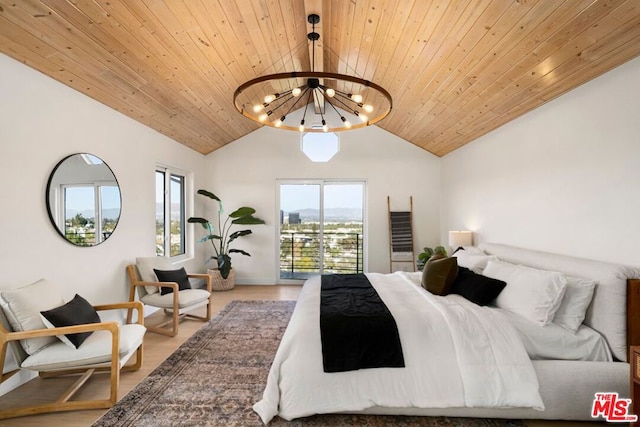 bedroom with lofted ceiling, wooden ceiling, hardwood / wood-style floors, and a notable chandelier