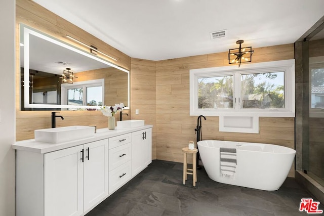 bathroom with a bath and vanity