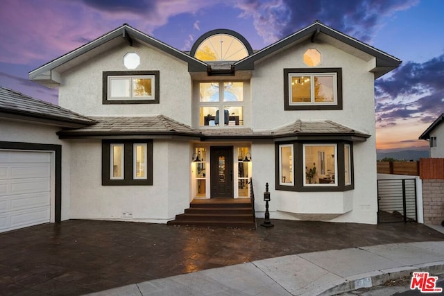 view of front of property with a garage