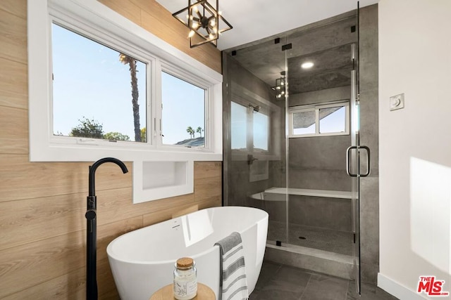 bathroom with an inviting chandelier and plus walk in shower