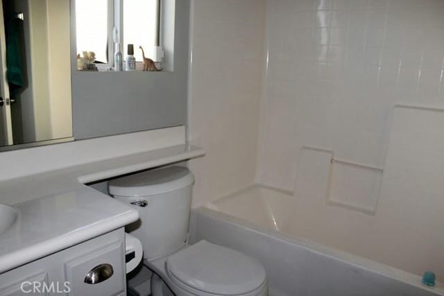 full bathroom with toilet, vanity, and bathing tub / shower combination