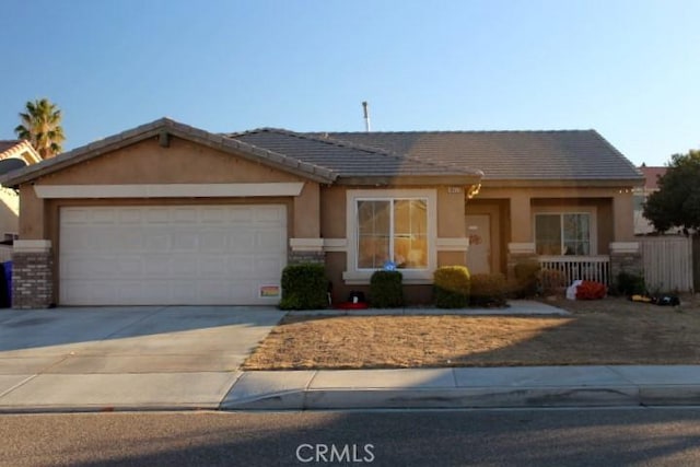 single story home with a garage