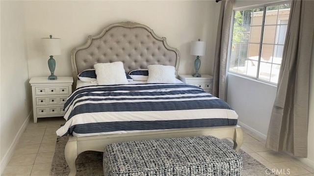 bedroom with light tile patterned flooring