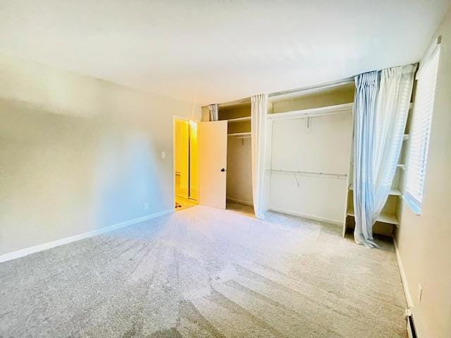 unfurnished bedroom with light colored carpet