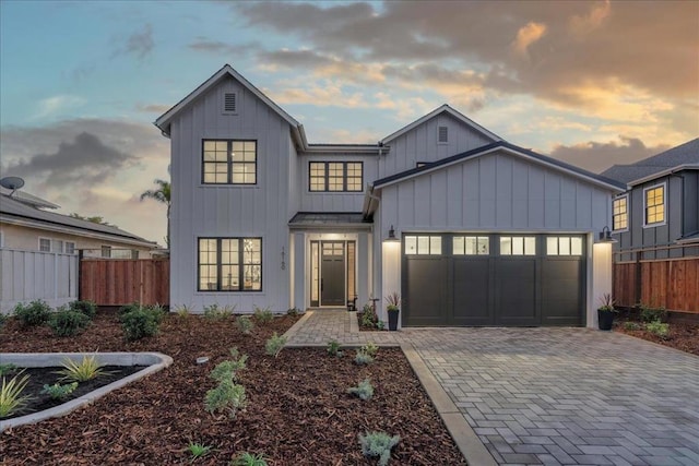 modern farmhouse style home featuring a garage