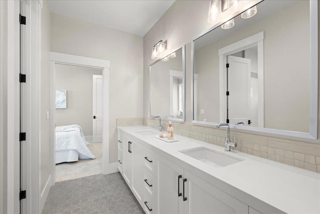 bathroom with tile patterned floors and vanity