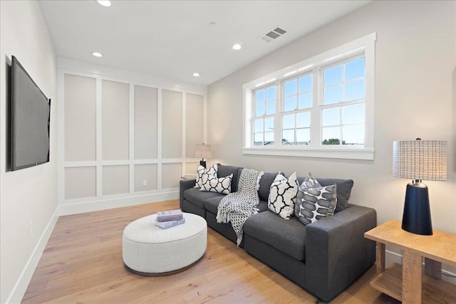 living room with light hardwood / wood-style flooring