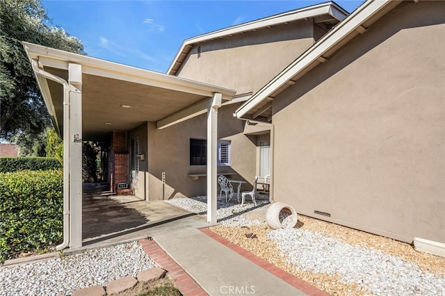 view of side of home featuring a patio