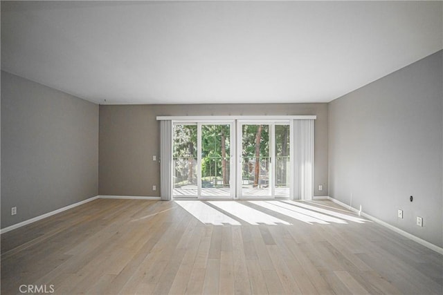 unfurnished room featuring light hardwood / wood-style floors