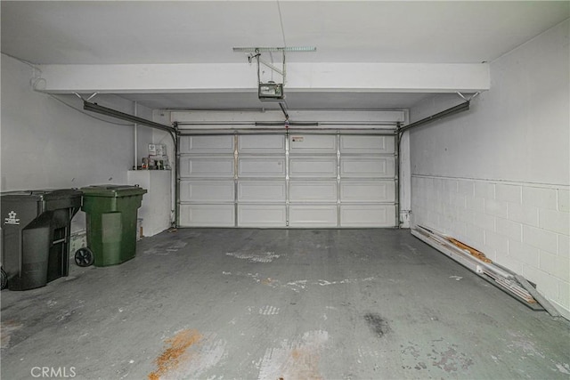 garage featuring a garage door opener