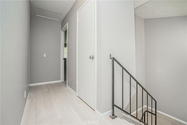 hall with light hardwood / wood-style floors