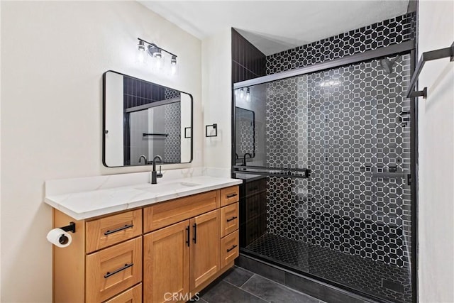 bathroom featuring vanity, tile patterned floors, and walk in shower