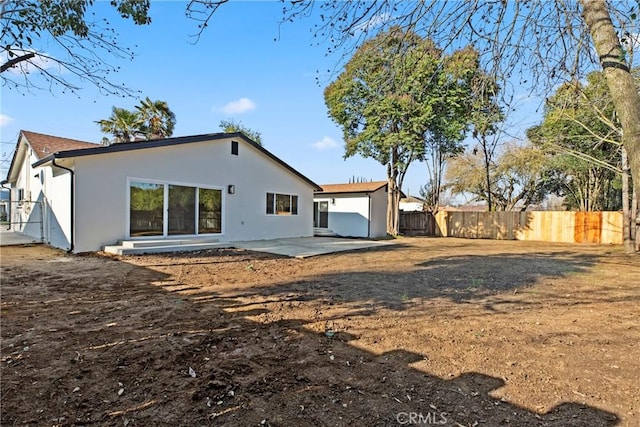 back of property with a patio area