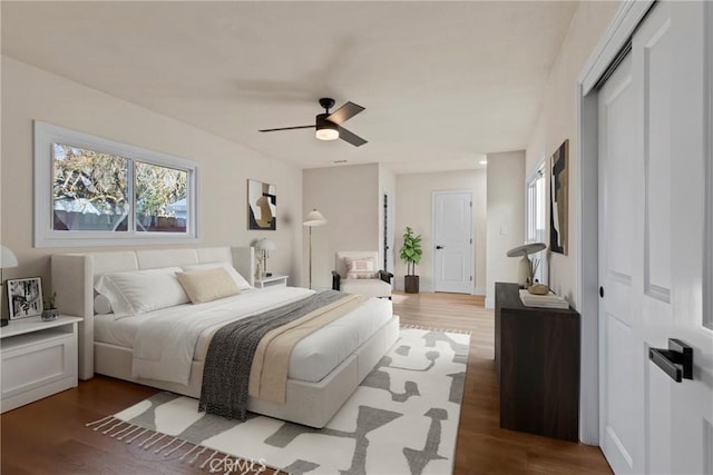 bedroom featuring wood-type flooring and ceiling fan