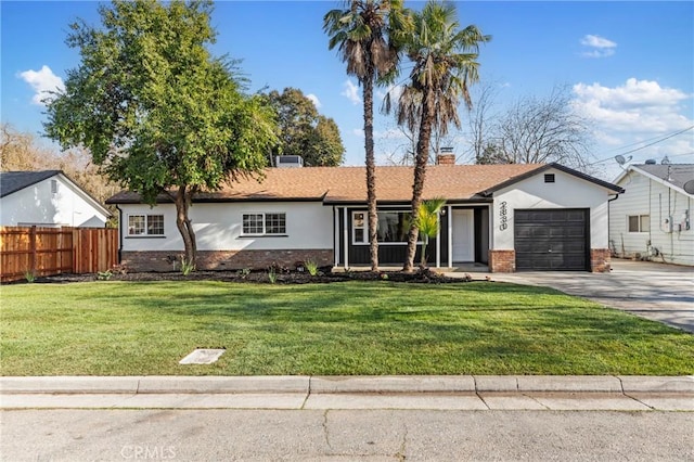 ranch-style home featuring a garage and a front lawn