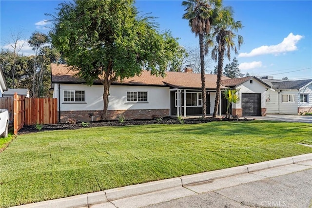 ranch-style home with a garage and a front yard