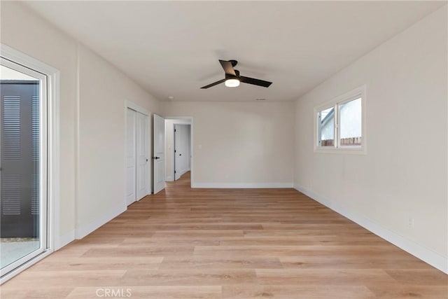 spare room featuring ceiling fan and light hardwood / wood-style floors