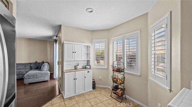 laundry area featuring light tile patterned floors