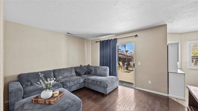 living room featuring dark hardwood / wood-style flooring