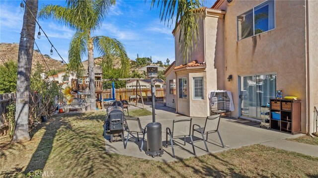 view of property's community with a patio area