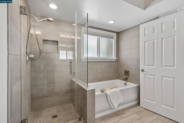 bathroom featuring plus walk in shower