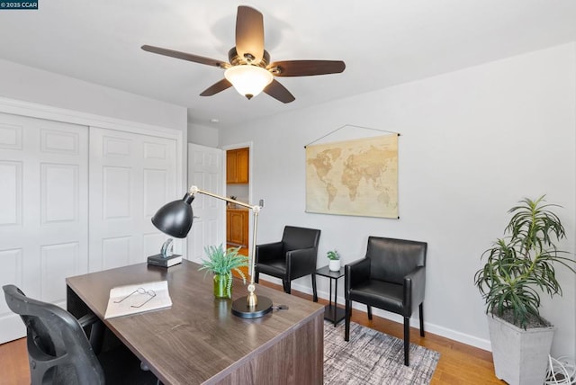 office area with ceiling fan and light hardwood / wood-style flooring