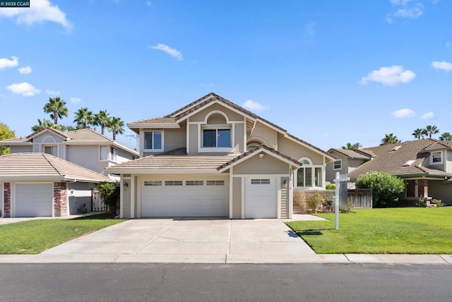 front facade with a front yard and a garage