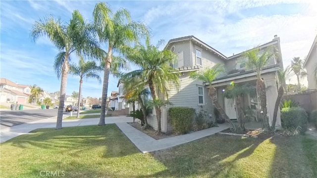 view of side of home featuring a lawn