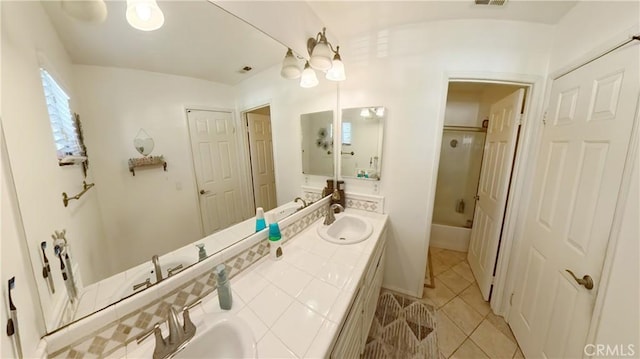 bathroom with shower / bathing tub combination, vanity, and tile patterned floors