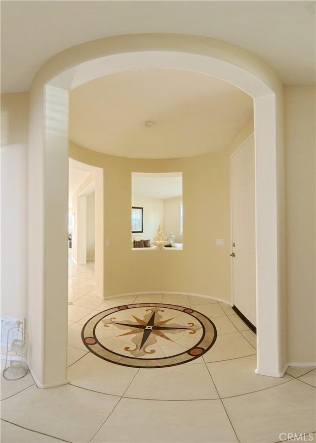 hallway featuring tile patterned flooring