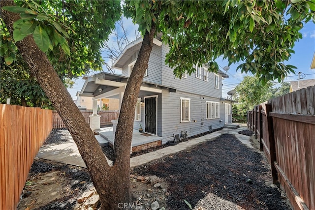 view of side of home with a patio area