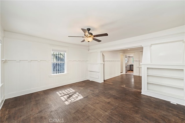 interior space featuring ceiling fan and dark hardwood / wood-style floors