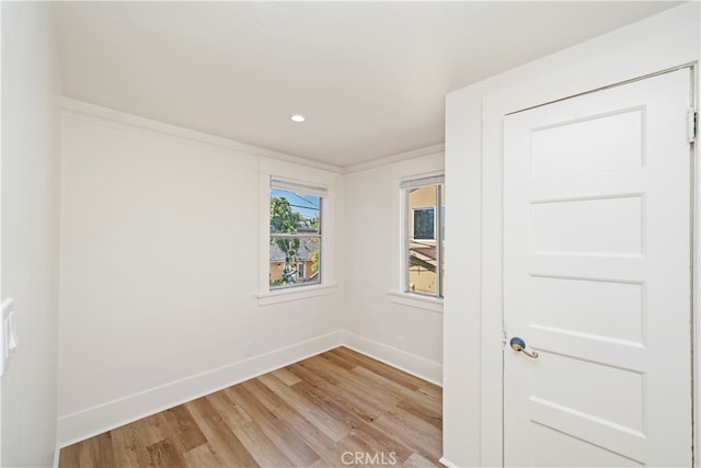 unfurnished room with light wood-type flooring