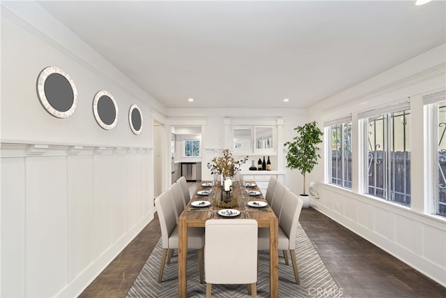 dining space with dark hardwood / wood-style floors