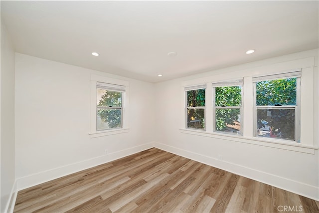 spare room with light wood-type flooring